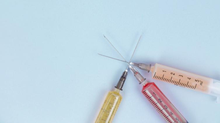 Three syringes with needle points